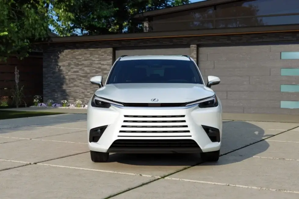 Lexus TX SUV parked in front of a house highlighting its spacious interior with potential for bench seating