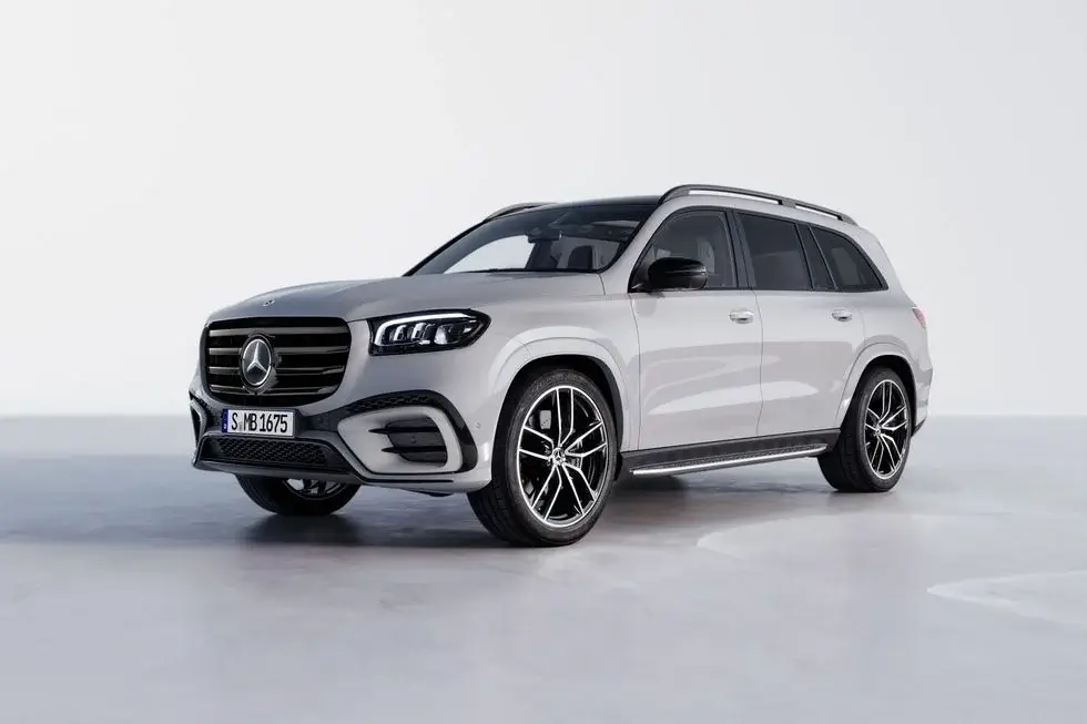 White 2024 Mercedes-Benz GLS SUV parked on a white background A Car with bench seat interior