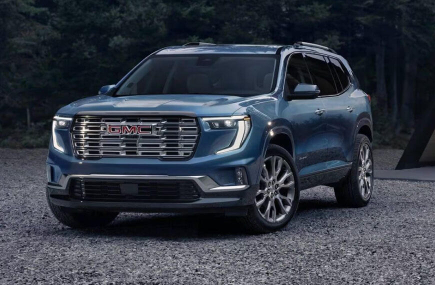 Front view of the 2025 GMC Acadia SUV in a dark metallic finish