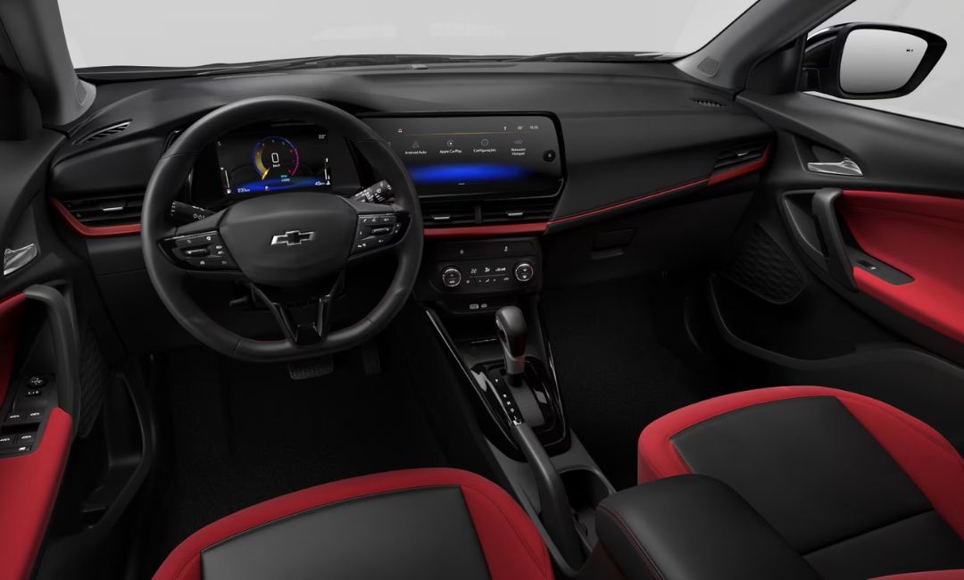 Interior dashboard of the 2026 Chevy Tracker with red-black upholstery and digital displays