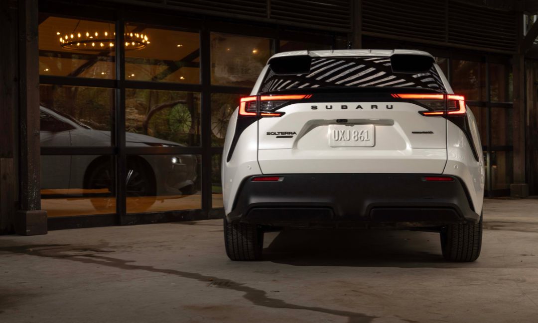Rear view of the 2026 Subaru Solterra EV showing full-width tail lights and Subaru badging