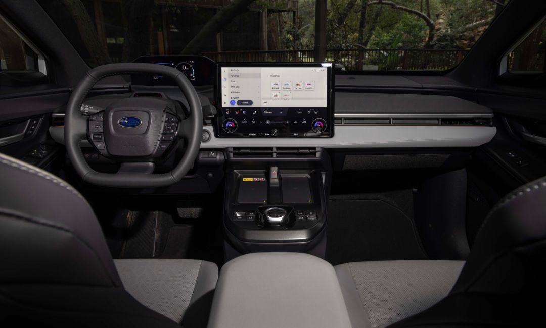 Interior of the 2026 Subaru Solterra EV featuring a large touchscreen and minimalist dashboard