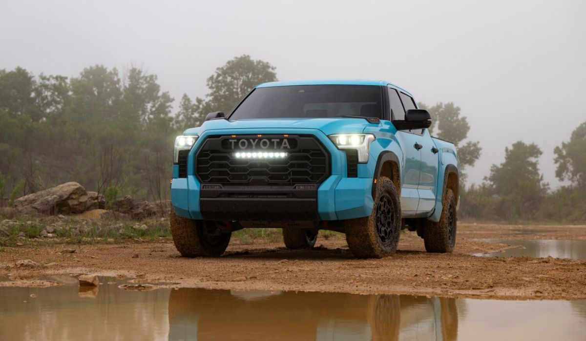 Front view of the 2026 Toyota Tundra TRD Pro in bold Wave Maker blue paint, shown in an off-road setting