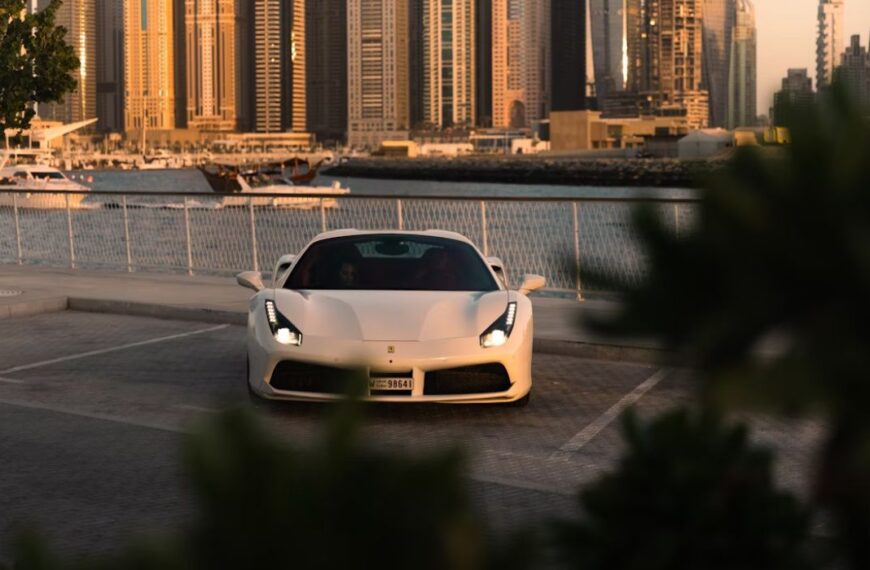 a white sports car parked in a parking lot