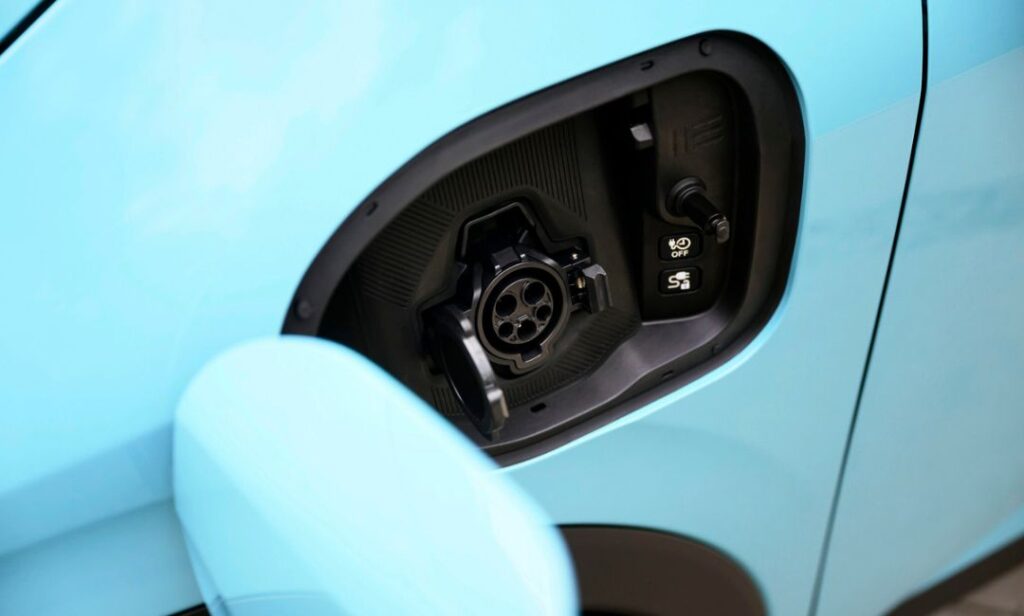 Driver-side J1772 charge port for Level 1 and Level 2 AC charging at home and public stations.